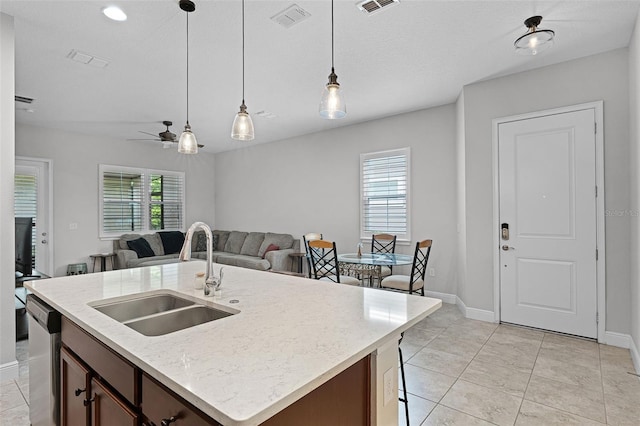 2419 Datura Loop, Saint Cloud, FL 34772 - kitchen featuring open floor plan, dishwasher, pendant lighting, a ceiling fan, and a center island with sink