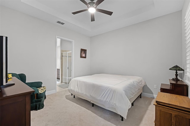 2419 Datura Loop, Saint Cloud, FL 34772 - bedroom featuring a raised ceiling, light carpet, and ceiling fan