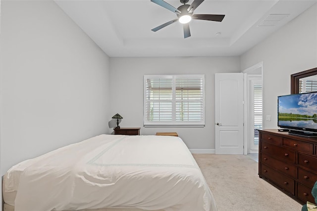 2419 Datura Loop, Saint Cloud, FL 34772 - bedroom with a tray ceiling, light colored carpet, and ceiling fan
