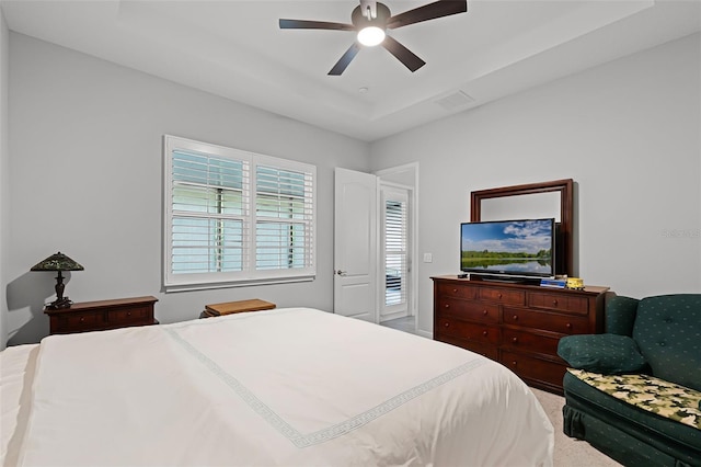 2419 Datura Loop, Saint Cloud, FL 34772 - carpeted bedroom featuring a ceiling fan and a tray ceiling