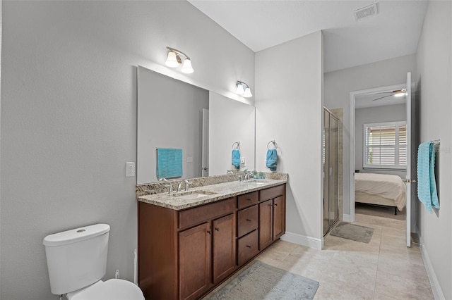 2419 Datura Loop, Saint Cloud, FL 34772 - full bath with double vanity, a shower stall, a ceiling fan, and tile patterned flooring