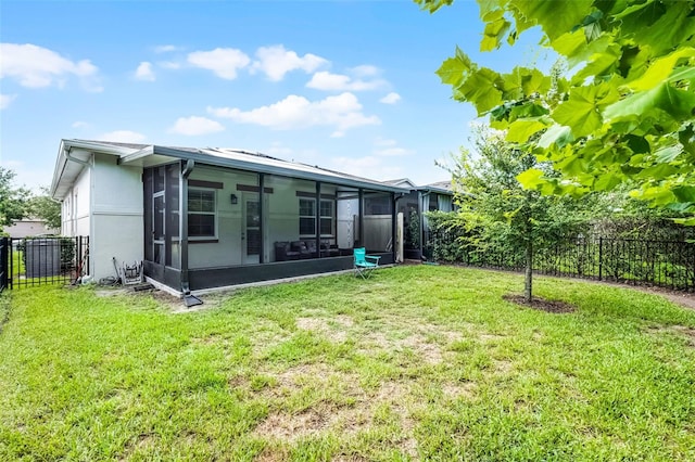 2419 Datura Loop, Saint Cloud, FL 34772 - rear view of house featuring a sunroom and a fenced backyard