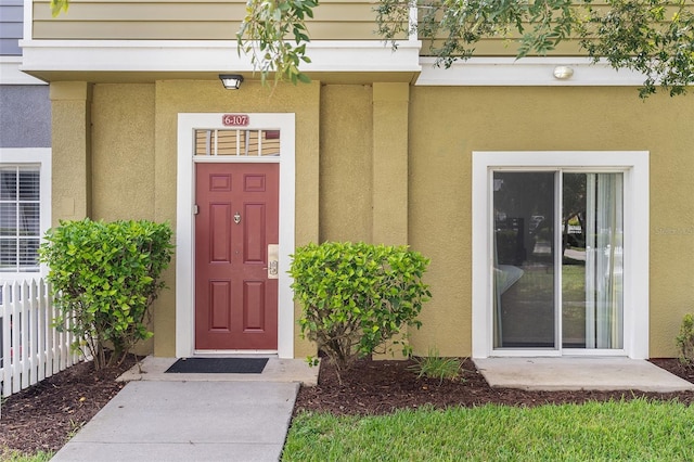 2602 Lodi Cir Unit 107, Kissimmee, FL 34746 - view of exterior entry with stucco siding