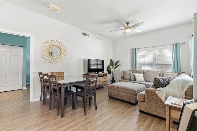 2602 Lodi Cir Unit 107, Kissimmee, FL 34746 - living area featuring light wood finished floors and ceiling fan
