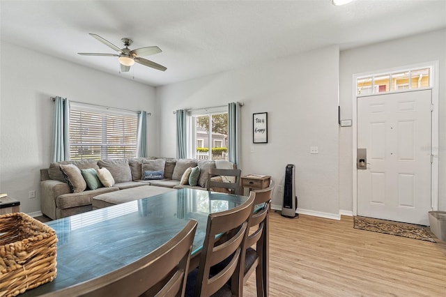 2602 Lodi Cir Unit 107, Kissimmee, FL 34746 - dining area featuring a ceiling fan and light wood-style flooring