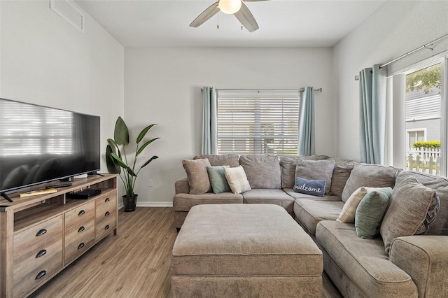 2602 Lodi Cir Unit 107, Kissimmee, FL 34746 - living room featuring light wood-style flooring and ceiling fan