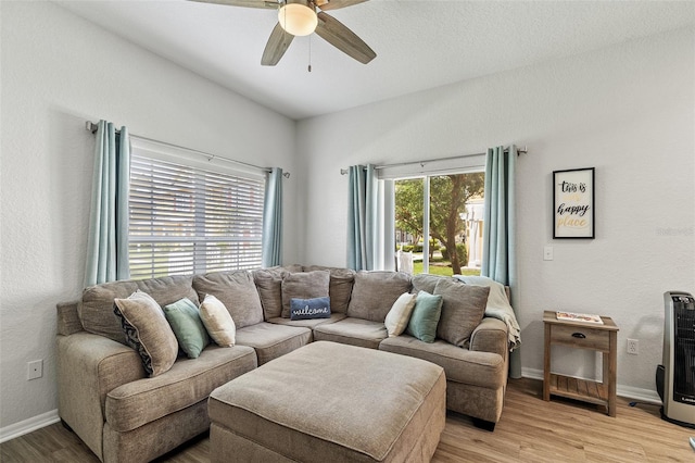 2602 Lodi Cir Unit 107, Kissimmee, FL 34746 - living area with a ceiling fan and light wood-style floors