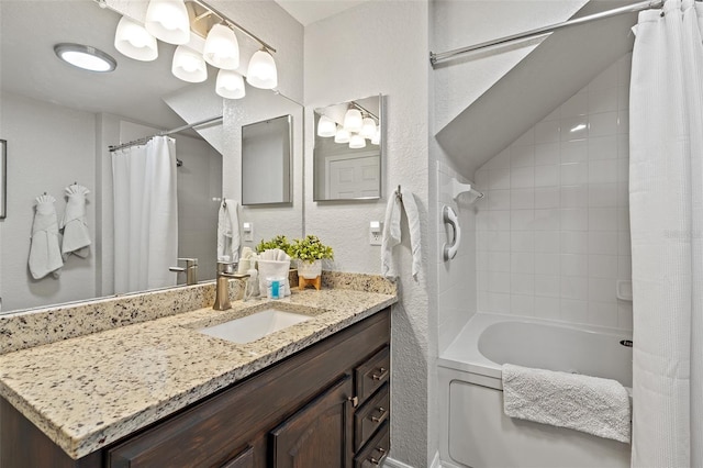 2602 Lodi Cir Unit 107, Kissimmee, FL 34746 - full bathroom featuring vanity, shower / tub combo, and a textured wall