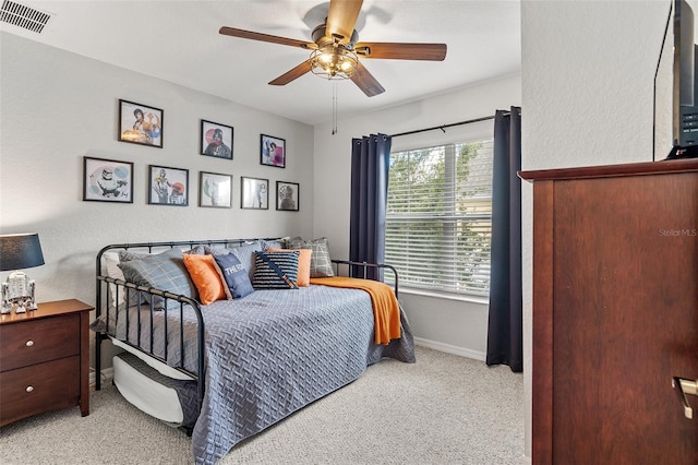2602 Lodi Cir Unit 107, Kissimmee, FL 34746 - bedroom with light carpet and ceiling fan