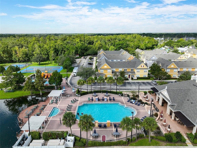 2602 Lodi Cir Unit 107, Kissimmee, FL 34746 - bird's eye view of a pool area and a nearby body of water