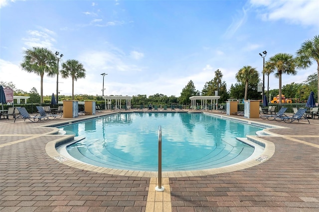 2602 Lodi Cir Unit 107, Kissimmee, FL 34746 - community pool featuring a patio and a pergola