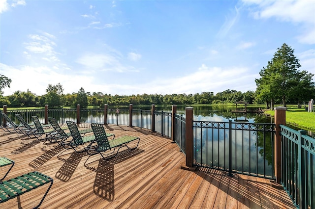 2602 Lodi Cir Unit 107, Kissimmee, FL 34746 - wooden terrace with a water view