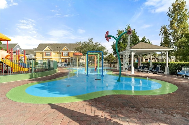 2602 Lodi Cir Unit 107, Kissimmee, FL 34746 - community pool with a water play area, a gazebo, and a patio