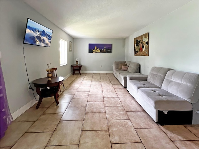4755 S Texas Ave Unit 4755D, Orlando, FL 32839 - living room featuring light tile patterned floors and a textured ceiling