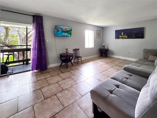 4755 S Texas Ave Unit 4755D, Orlando, FL 32839 - tiled living area featuring baseboards