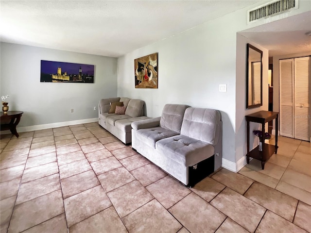 4755 S Texas Ave Unit 4755D, Orlando, FL 32839 - living room featuring light tile patterned flooring and baseboards