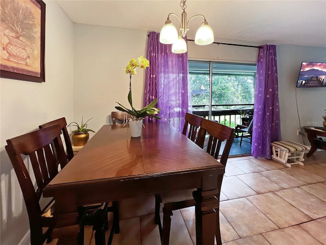 4755 S Texas Ave Unit 4755D, Orlando, FL 32839 - dining area featuring a chandelier and light tile patterned floors