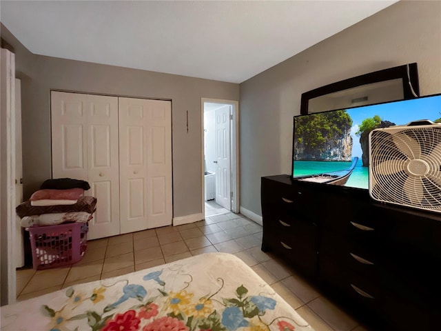 4755 S Texas Ave Unit 4755D, Orlando, FL 32839 - bedroom with light tile patterned floors, a closet, and connected bathroom