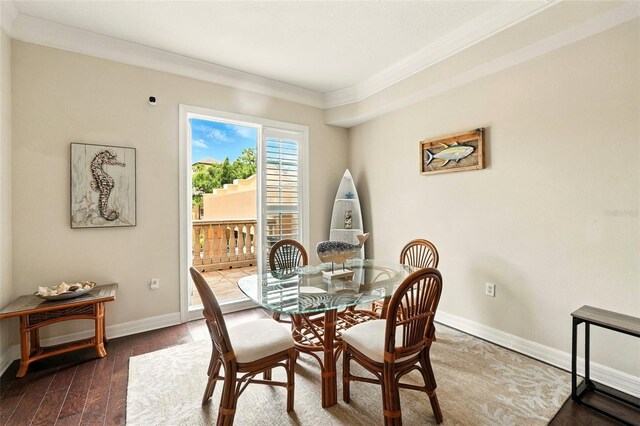 501 Mirasol Cir Unit 213, Celebration, FL 34747 - dining area with crown molding and wood finished floors