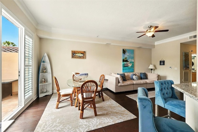 501 Mirasol Cir Unit 213, Celebration, FL 34747 - living room with crown molding, a ceiling fan, and dark wood-type flooring