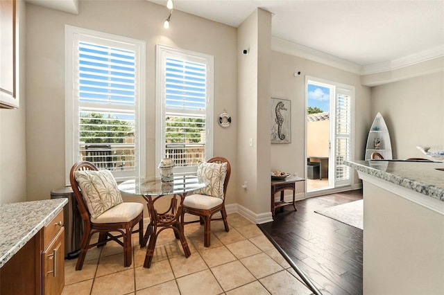 501 Mirasol Cir Unit 213, Celebration, FL 34747 - dining area with plenty of natural light, crown molding, and light tile patterned floors