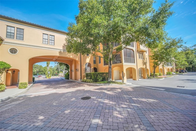 501 Mirasol Cir Unit 213, Celebration, FL 34747 - mediterranean / spanish house with stucco siding and decorative driveway