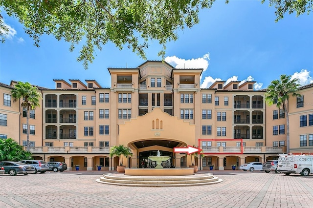501 Mirasol Cir Unit 213, Celebration, FL 34747 - view of property featuring uncovered parking