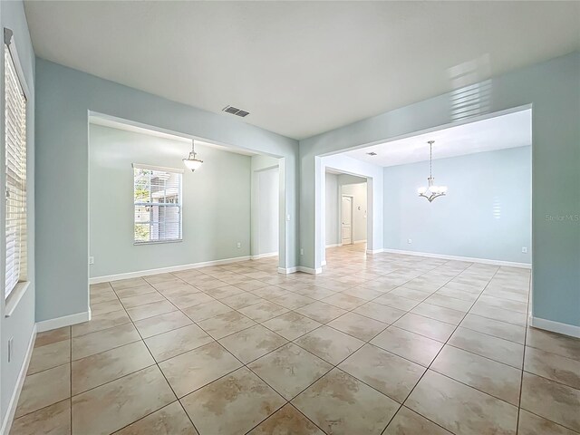 15150 Evergreen Oak Loop, Winter Garden, FL 34787 - spare room featuring light tile patterned flooring and a chandelier