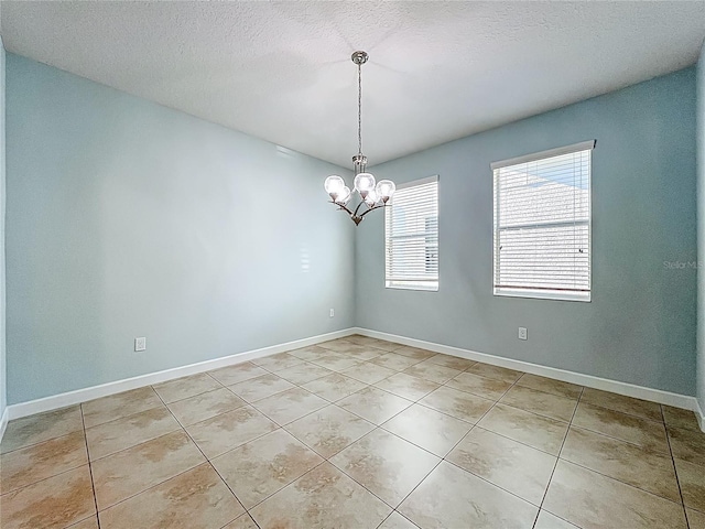 15150 Evergreen Oak Loop, Winter Garden, FL 34787 - spare room with light tile patterned floors, a chandelier, and a textured ceiling