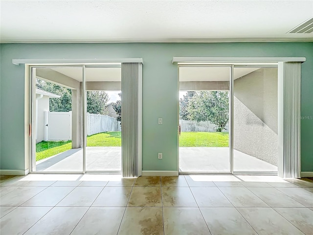 15150 Evergreen Oak Loop, Winter Garden, FL 34787 - doorway to outside featuring tile patterned floors and plenty of natural light
