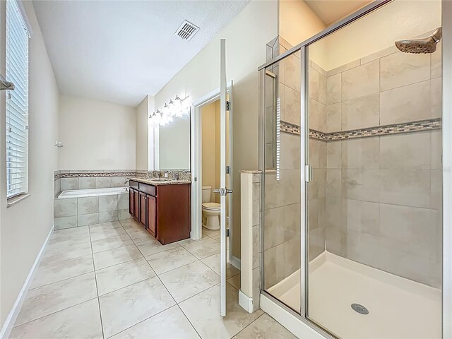 15150 Evergreen Oak Loop, Winter Garden, FL 34787 - full bath featuring a shower stall, a garden tub, vanity, and tile patterned flooring