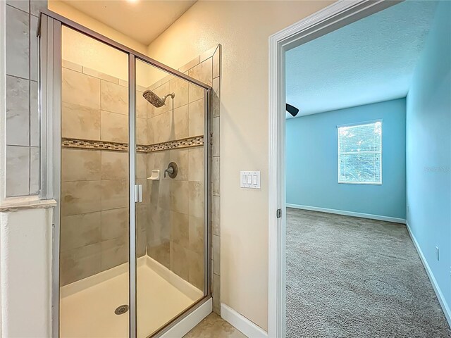 15150 Evergreen Oak Loop, Winter Garden, FL 34787 - bathroom featuring a stall shower and baseboards