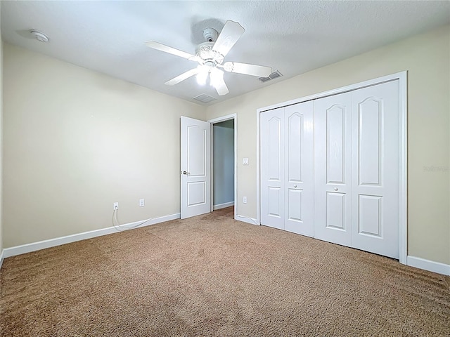 15150 Evergreen Oak Loop, Winter Garden, FL 34787 - unfurnished bedroom featuring carpet flooring, a closet, and a ceiling fan