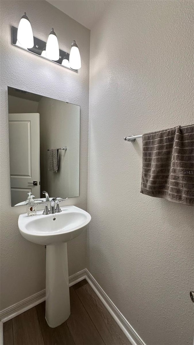1528 Mirabella Cir, Davenport, FL 33897 - bathroom with baseboards and wood finished floors