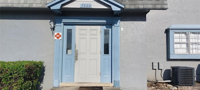 7429 Daniel Webster Dr Unit 13E Aka A, Winter Park, FL 32792 - doorway to property featuring stucco siding