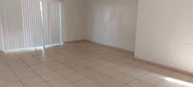 7429 Daniel Webster Dr Unit 13E Aka A, Winter Park, FL 32792 - unfurnished room featuring light tile patterned flooring and baseboards