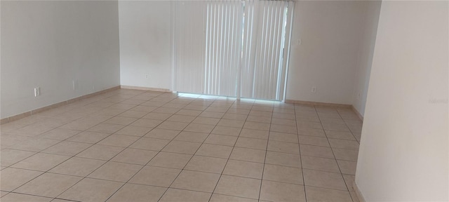 7429 Daniel Webster Dr Unit 13E Aka A, Winter Park, FL 32792 - empty room featuring light tile patterned floors and baseboards