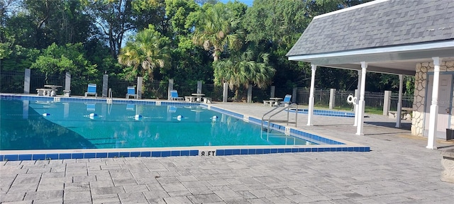 7429 Daniel Webster Dr Unit 13E Aka A, Winter Park, FL 32792 - community pool with a patio and view of scattered trees