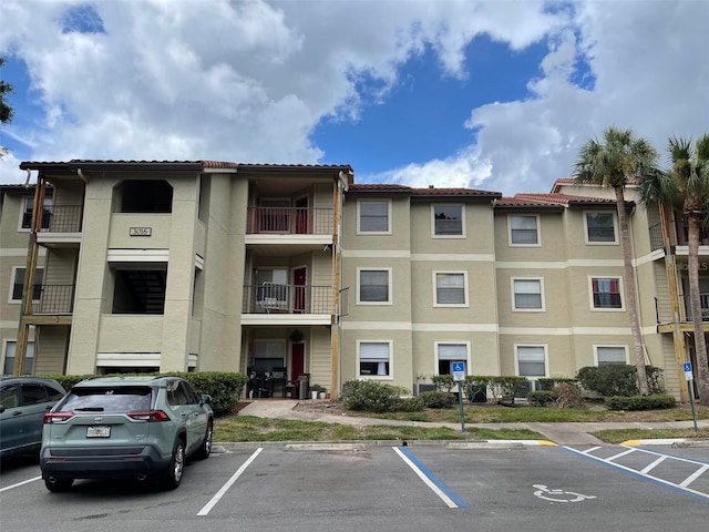 3016 Parkway Blvd Unit 303, Kissimmee, FL 34747 - view of property featuring uncovered parking