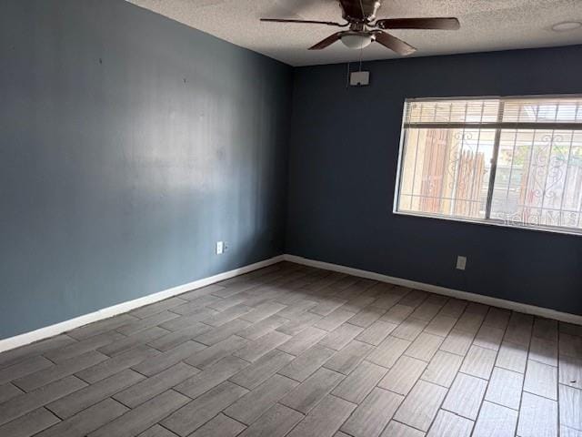 5423 Brookswood Way Unit 801, Orlando, FL 32808 - unfurnished room with a textured ceiling, ceiling fan, and wood finished floors