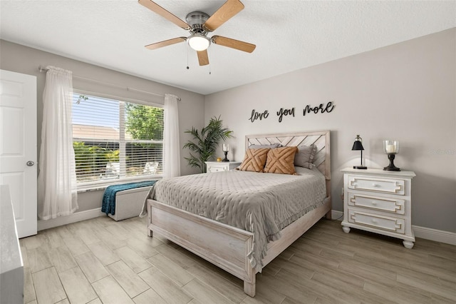 2313 Duncan Trl, Clermont, FL 34714 - bedroom with light wood-style floors and ceiling fan