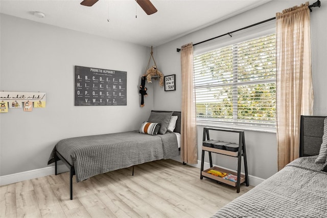 2313 Duncan Trl, Clermont, FL 34714 - bedroom with wood finished floors and a ceiling fan