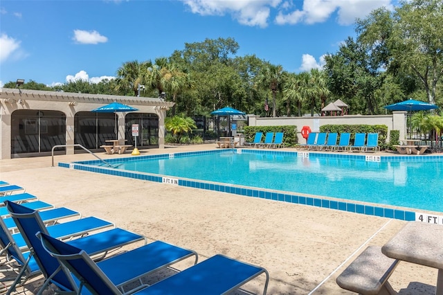 2313 Duncan Trl, Clermont, FL 34714 - community pool with a patio area and view of wooded area