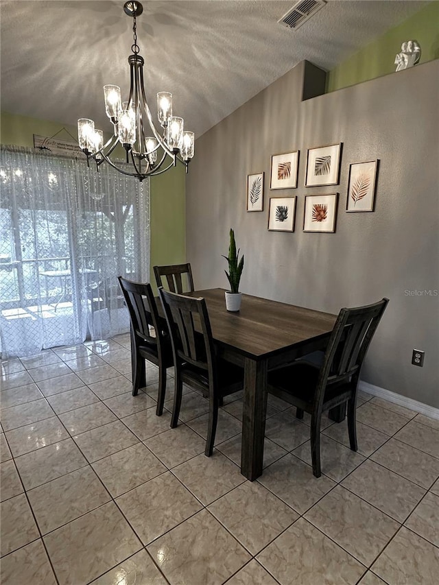 2333 Ainsworth Ave, Deltona, FL 32738 - dining area featuring a chandelier, light tile patterned floors, and a textured ceiling