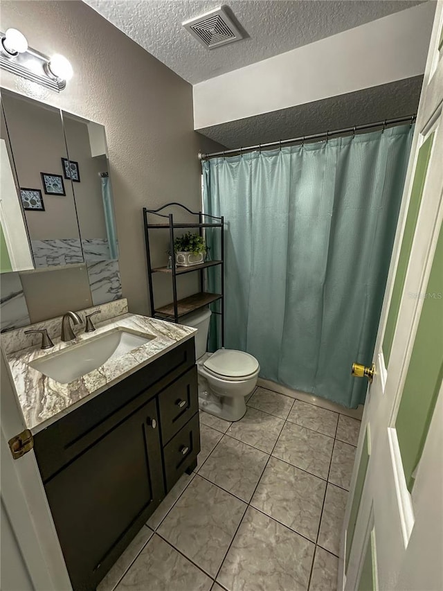 2333 Ainsworth Ave, Deltona, FL 32738 - full bathroom with a textured ceiling, vanity, a textured wall, tile patterned floors, and a shower with shower curtain