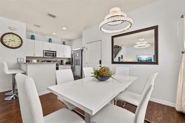 5372 Diplomat Ct Unit 108, Kissimmee, FL 34746 - dining area with dark wood finished floors and recessed lighting