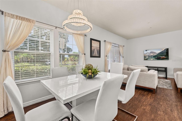 5372 Diplomat Ct Unit 108, Kissimmee, FL 34746 - dining space featuring dark wood-style flooring and a chandelier