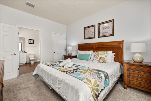5372 Diplomat Ct Unit 108, Kissimmee, FL 34746 - bedroom with carpet and ensuite bath