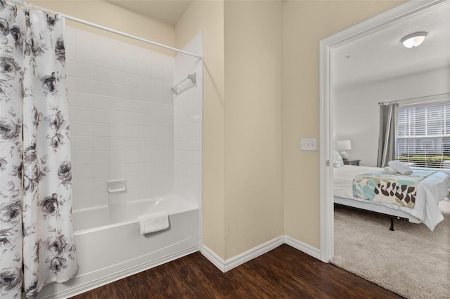 5372 Diplomat Ct Unit 108, Kissimmee, FL 34746 - ensuite bathroom with wood finished floors and shower / bath combination with curtain