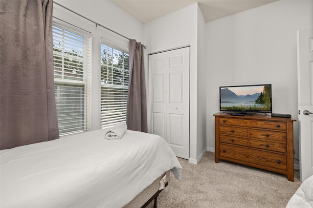 5372 Diplomat Ct Unit 108, Kissimmee, FL 34746 - bedroom featuring light carpet and a closet